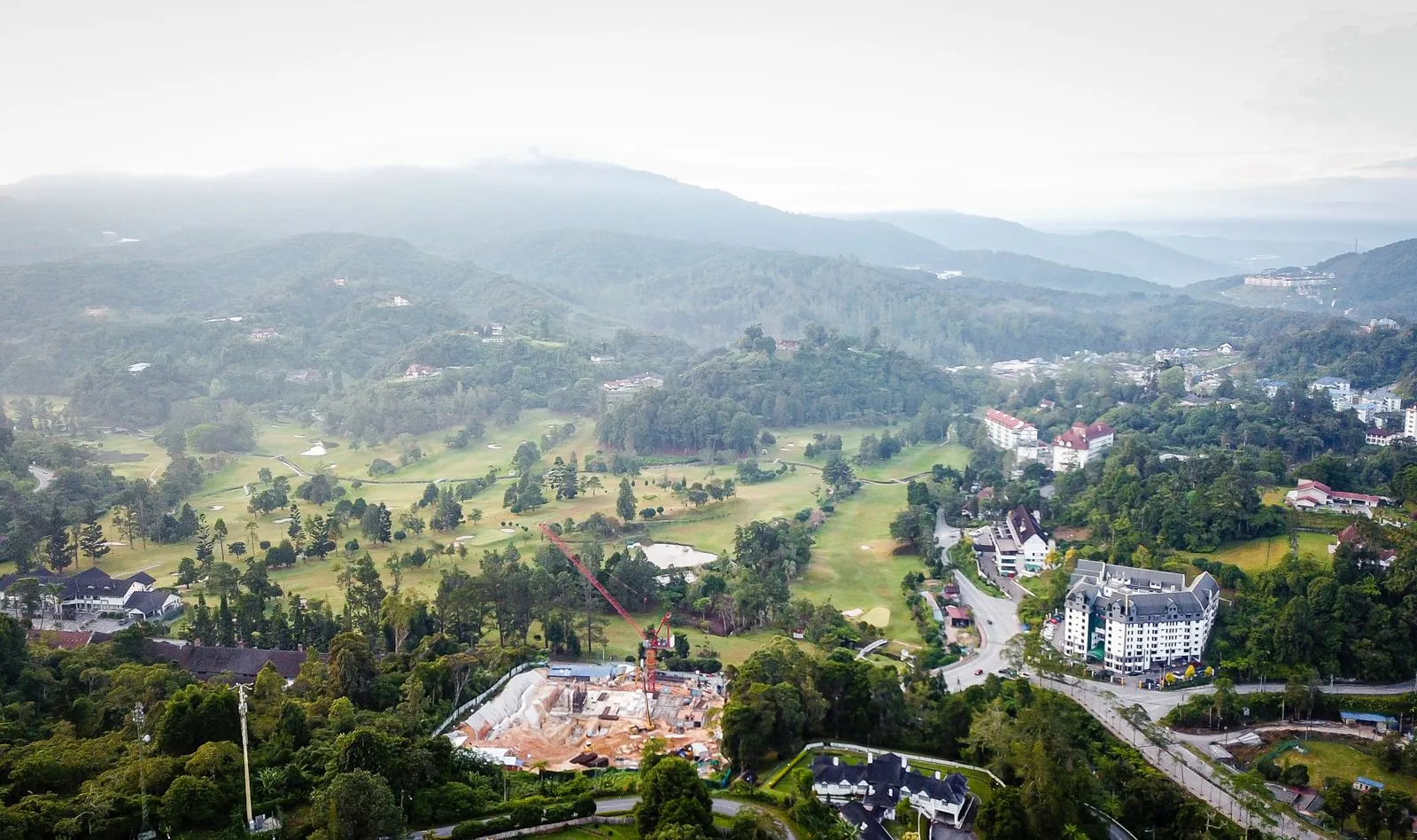 Aerial view of Tanah Rata with the golf course, hotels and a building site