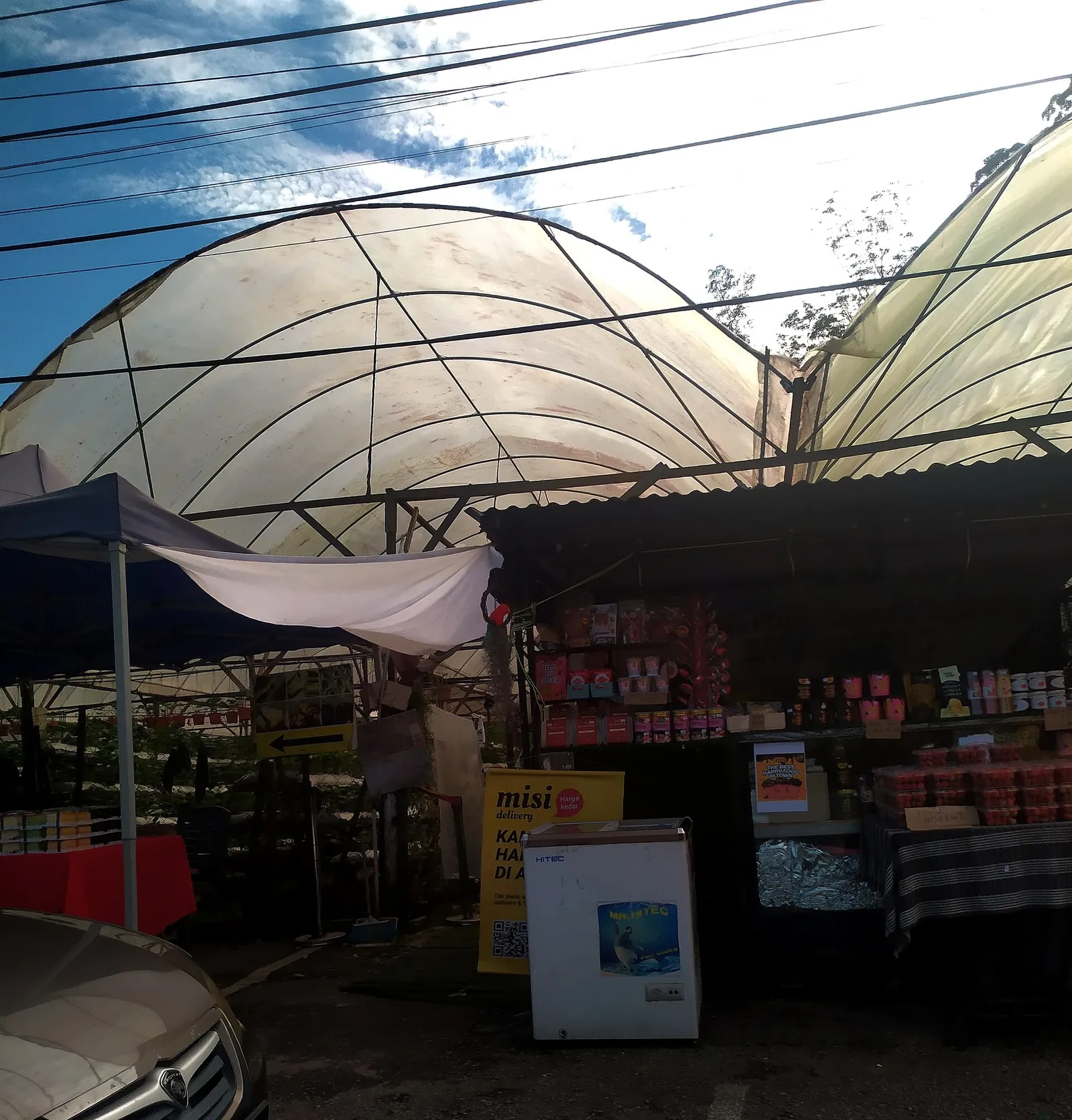 Greenhouse and a roadside stall at a strawberry farm in Kampung Taman Sedia