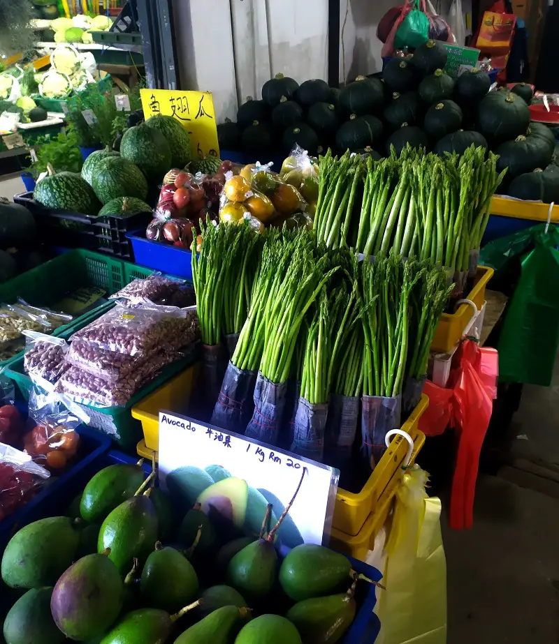 Asparagus, avocados and other fresh produce on a market stall at Kea Farm