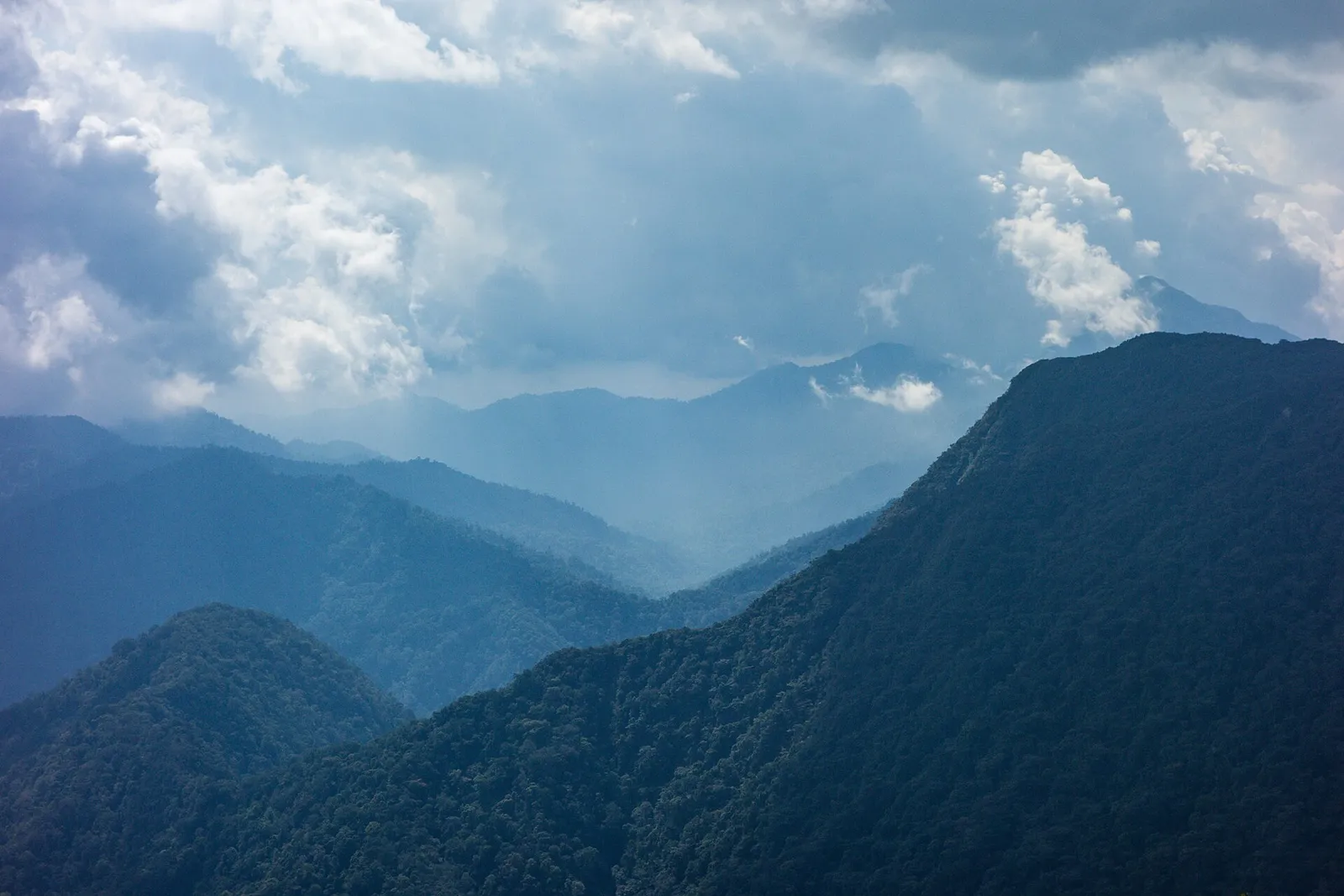 Blue mountain ridges under cloud, seen from Gunung Irau